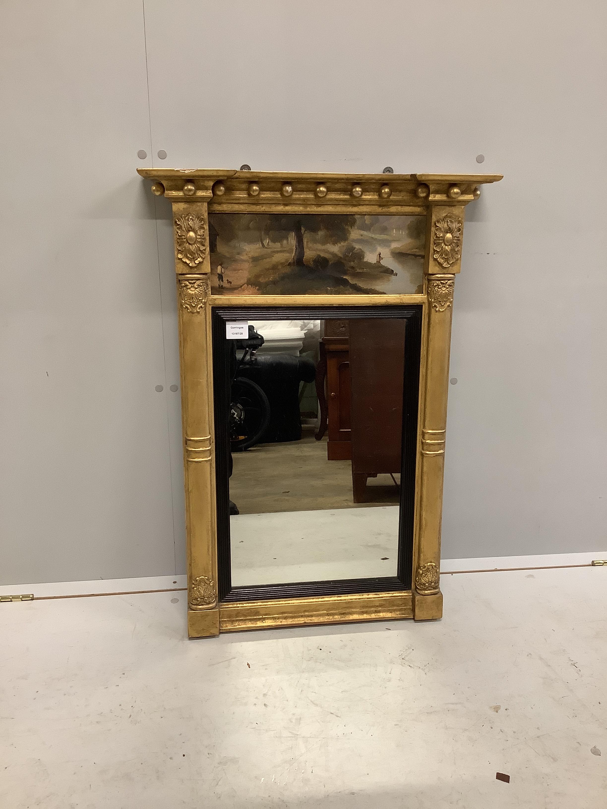 A Regency gilt wood and composition pier glass with painted landscape frieze, width 61cm, height 88cm
